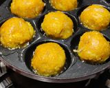 A picture of step 4 of Corn fritters in appe pan.