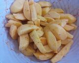 A picture of step 2 of Baked turmeric potato wedges.