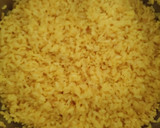 Foto del paso 3 de la receta: Arroz al wok con alitas de pollo y con cebolla, zanahoria y pimientos a la mantequilla y yakiniku