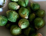 A picture of step 1 of My Roasted Sprouts in orange,crushed Walnuts and Cranberry sauce.