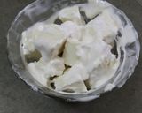 A picture of step 3 of Rajasthani ghevar with white chocolate ganache.