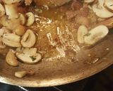 A picture of step 16 of Roast Chicken Thighs in a Sautéed Mushroom Parmasan Garlic Cream.
