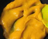 A picture of step 2 of Mango flavoured milk cake in two layers.