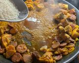 A picture of step 5 of Paella, chicken, chorizo & prawns.