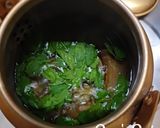 A picture of step 1 of Tulsi and Palm Jaggery Tea.
