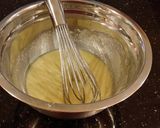A picture of step 7 of Blueberry Strusel Muffins with a White Chocolaye Drizzle.