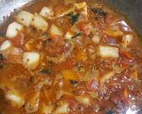 A picture of step 3 of Aloo Gobhi Matar curry.