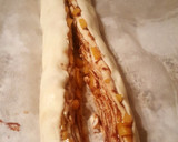 Foto del paso 5 de la receta: Rosca de hojaldre rellena de crema de chocolate y melocotón