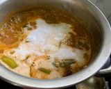 A picture of step 8 of Kerala Style Baingan Dal Curry.