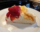A picture of step 10 of Pavlova with lemon curd and strawberries.
