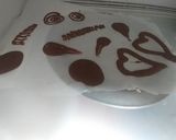 A picture of step 1 of Chocolate cup with brownie and icecream on top.