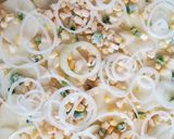 A picture of step 2 of Jalapeno Corn Scalloped Potatoes with garlic and lime bechamel.