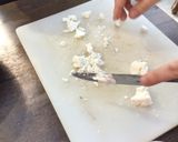 A picture of step 1 of Goat cheese & jam crackers.