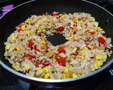 A picture of step 7 of Thai style fried rice with vegetables and tofu.