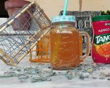 A picture of step 1 of Orange Tang Cocktail.