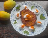 A picture of step 7 of Mango malpua with fresh cream.