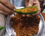 A picture of step 3 of Dana Methi stuffed Mirchi.