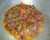 A picture of step 6 of Spicy daal karela.