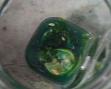 A picture of step 2 of Blue lagoon mojito.