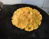 A picture of step 2 of Thepla cheese sandwich.