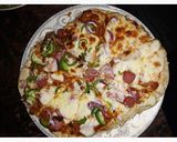 A picture of step 2 of Sausage pizza.