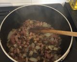 A picture of step 1 of Bacon and mushroom sauce with courgette ribbons.