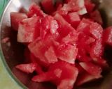 A picture of step 1 of Street style water melon with red juice.