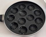 A picture of step 9 of Healthy Atta Jaggery Muffins in Appe Pan.