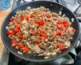 Une image de l'étape 10 de Aubergines farcies au bœuf, tomates et courgette.