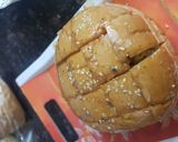 A picture of step 3 of Pull over garlic bread.