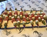 A picture of step 7 of Appetizer Skewers with Green Olives, Tomato, Prosciutto, and Pyrenees Cheese.