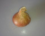 A picture of step 1 of Shakshuka with Onions and Tomatoes.