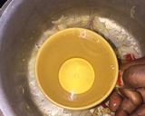 A picture of step 3 of Fish peepered soup garnish with parsely.