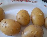 Foto del paso 1 de la receta: Patatas rellenas de jamón -al horno-