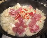 A picture of step 3 of Pan fry enokitake with bacon 🥓.