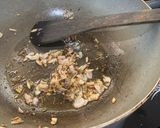 A picture of step 1 of Tamarind side dish parupu urandai puli kozumbu.