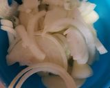 A picture of step 1 of Chicken breast on a bed of sauted apples and onions.