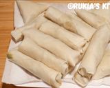 A picture of step 6 of Chicken springrolls.