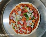 A picture of step 2 of Veg. Pizza.