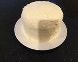 A picture of step 13 of Vanilla Layer Cake filled withLenon and Rasberry and frosted with Fresh Lemon Cream.