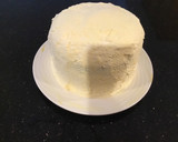 A picture of step 13 of Vanilla Layer Cake filled withLenon and Rasberry and frosted with Fresh Lemon Cream.
