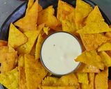 A picture of step 4 of Nachos with cheesy dip.