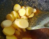 A picture of step 7 of Maacher Matha'r Ghonto/Fish Head Curry.