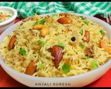A picture of step 10 of Kashmiri Pulao.
