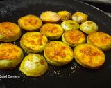 A picture of step 2 of Brinjal disk or baigan bhaja.