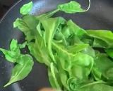 A picture of step 2 of Spinach saute - one more green on a plate.