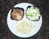 A picture of step 1 of Raw mango,garlic pickle.