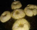 A picture of step 1 of Doughnut coated in sugar.