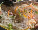 A picture of step 7 of Japchae - Korean vermicelli with meat and vegetables.