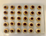 A picture of step 7 of Hazelnut Thumbprint Cookies.